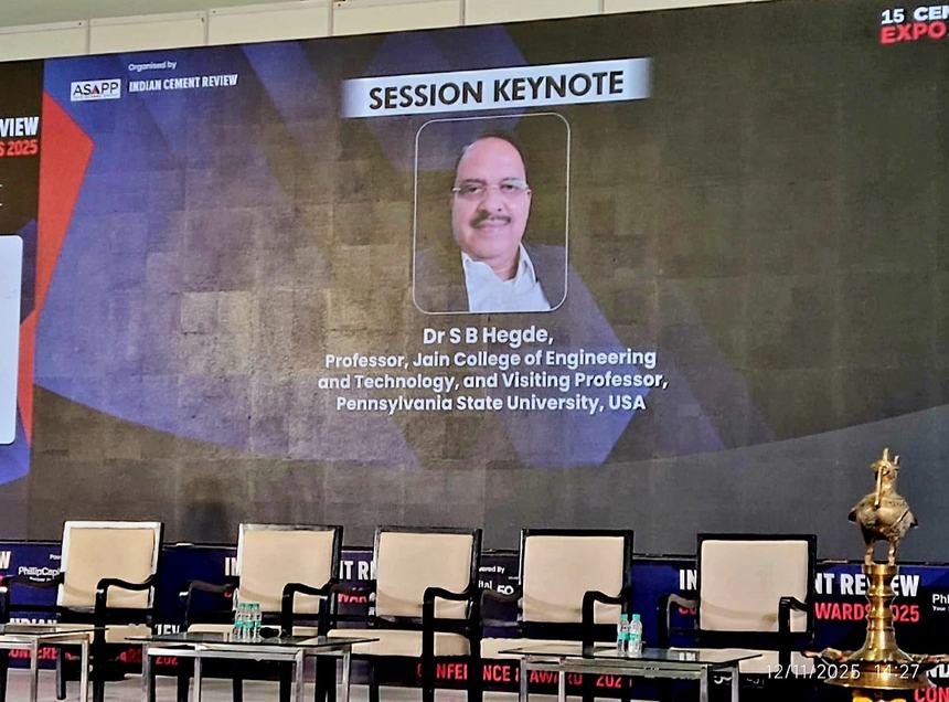 Large conference screen announcing Dr S B Hegde as Session Keynote at the Indian Cement Review conference