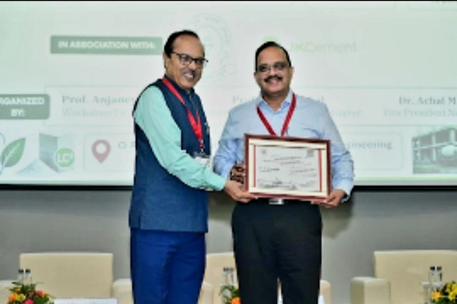 Dr Hegde receiving a framed certificate at the LC3 capacity building workshop
